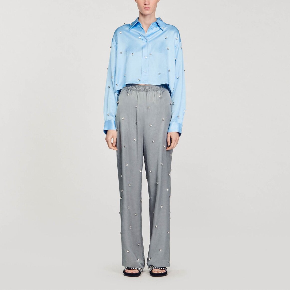 Pantalon en lin orné de strass Sandro seconde main