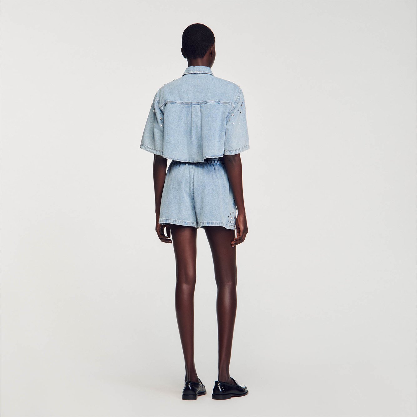 Short large en denim orné de strass Sandro seconde main