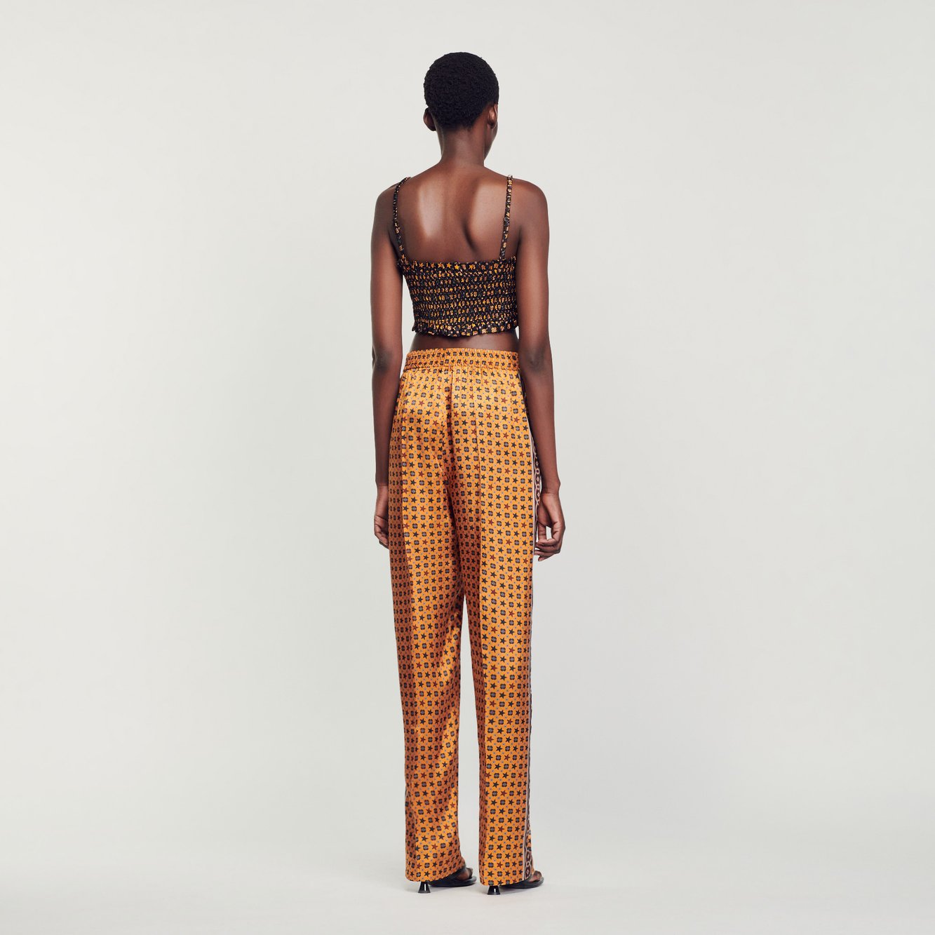 Pantalon satiné imprimé Sandro seconde main