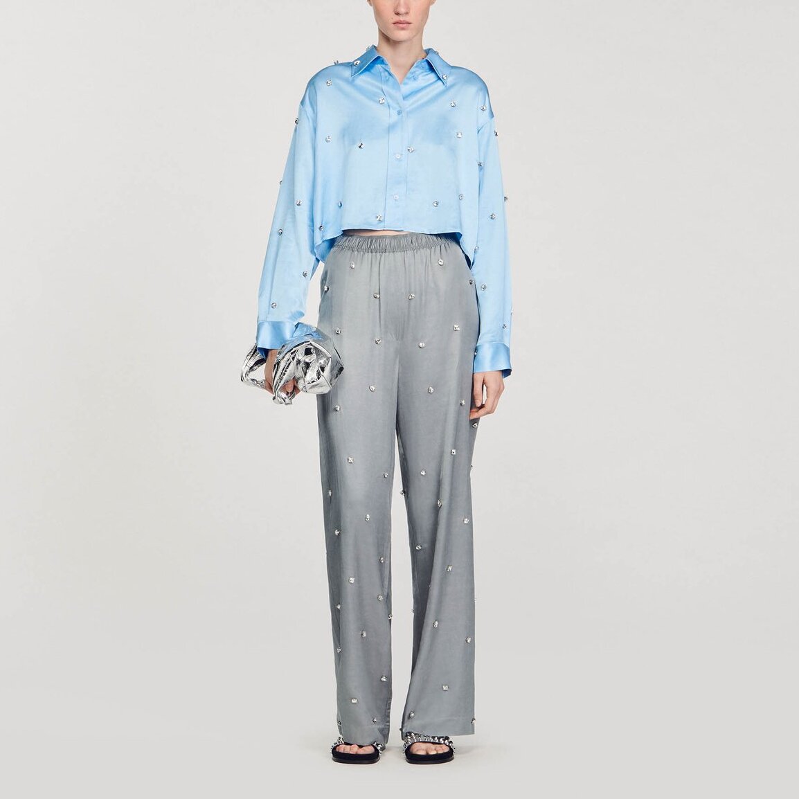 Pantalon en lin orné de strass Sandro seconde main