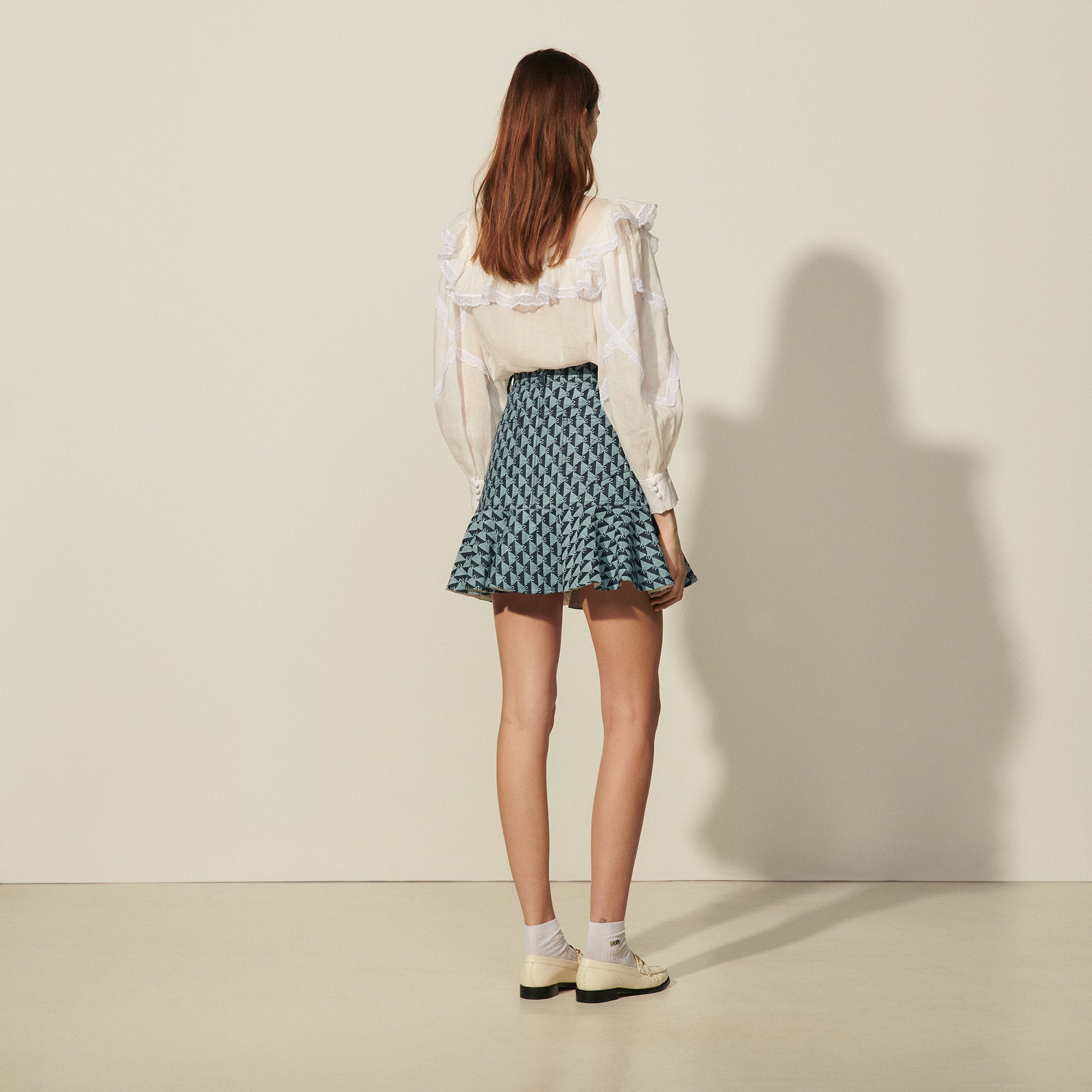 Jupe courte en monogramme denim Sandro seconde main