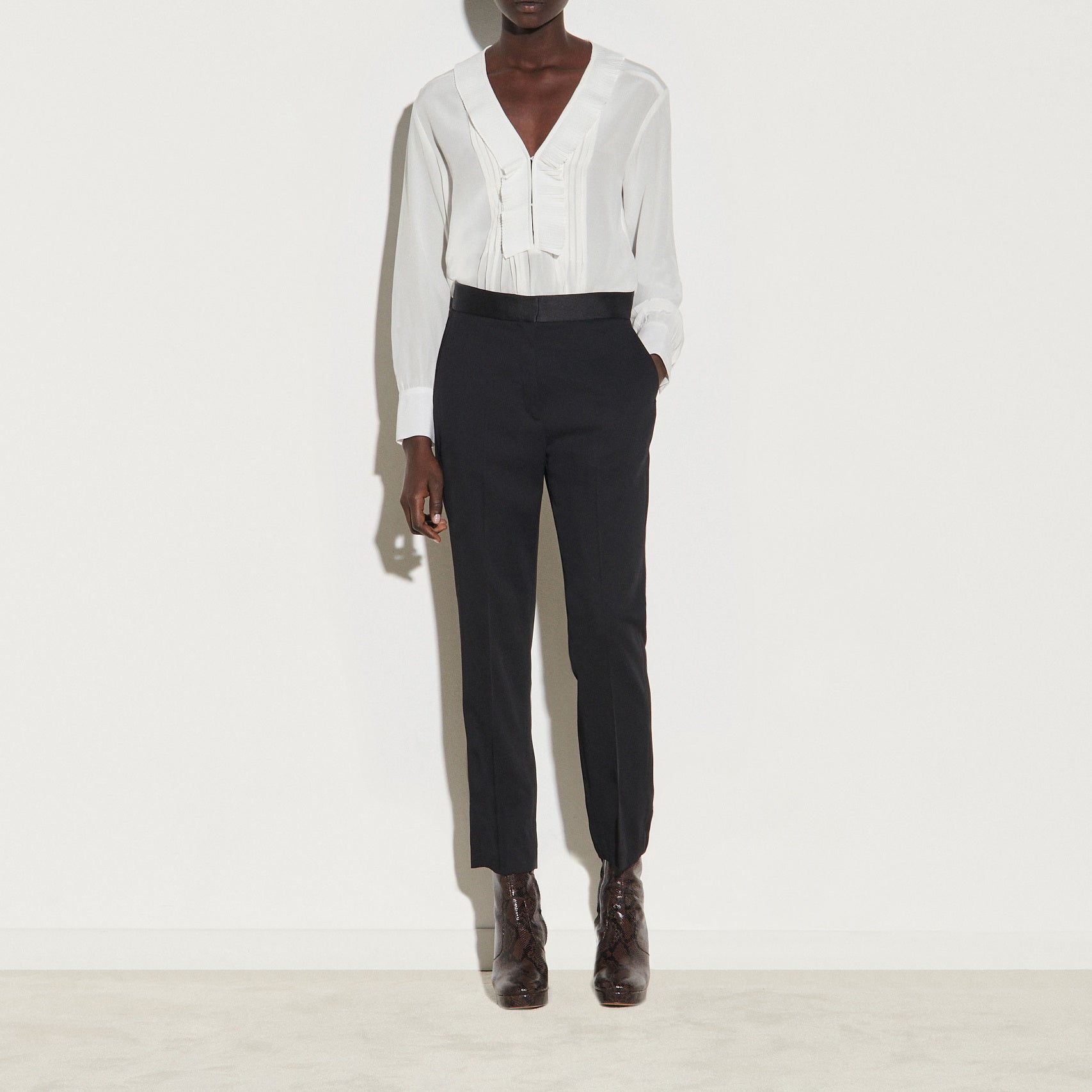 Pantalon avec empiècement de satin Sandro seconde main