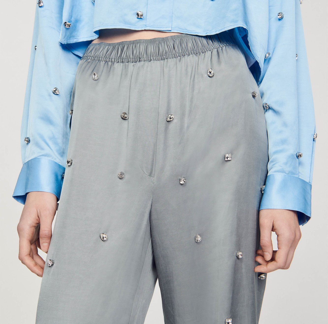 Pantalon en lin orné de strass Sandro seconde main