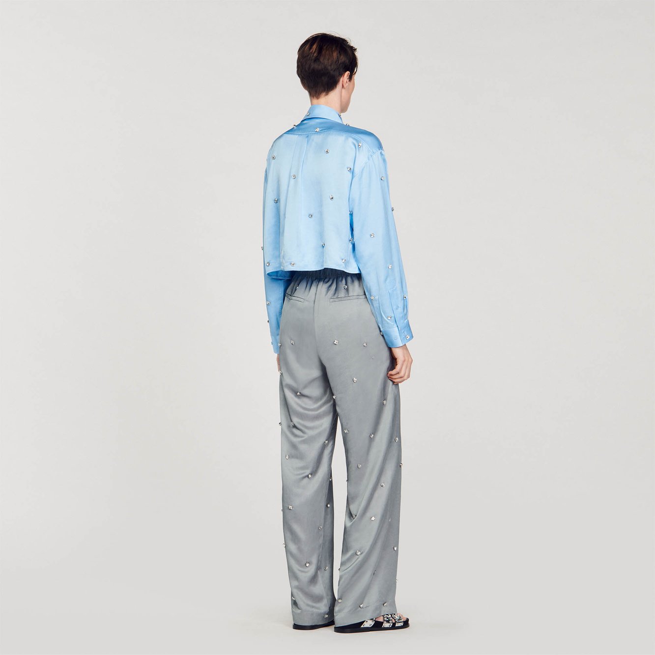 Pantalon en lin orné de strass Sandro seconde main