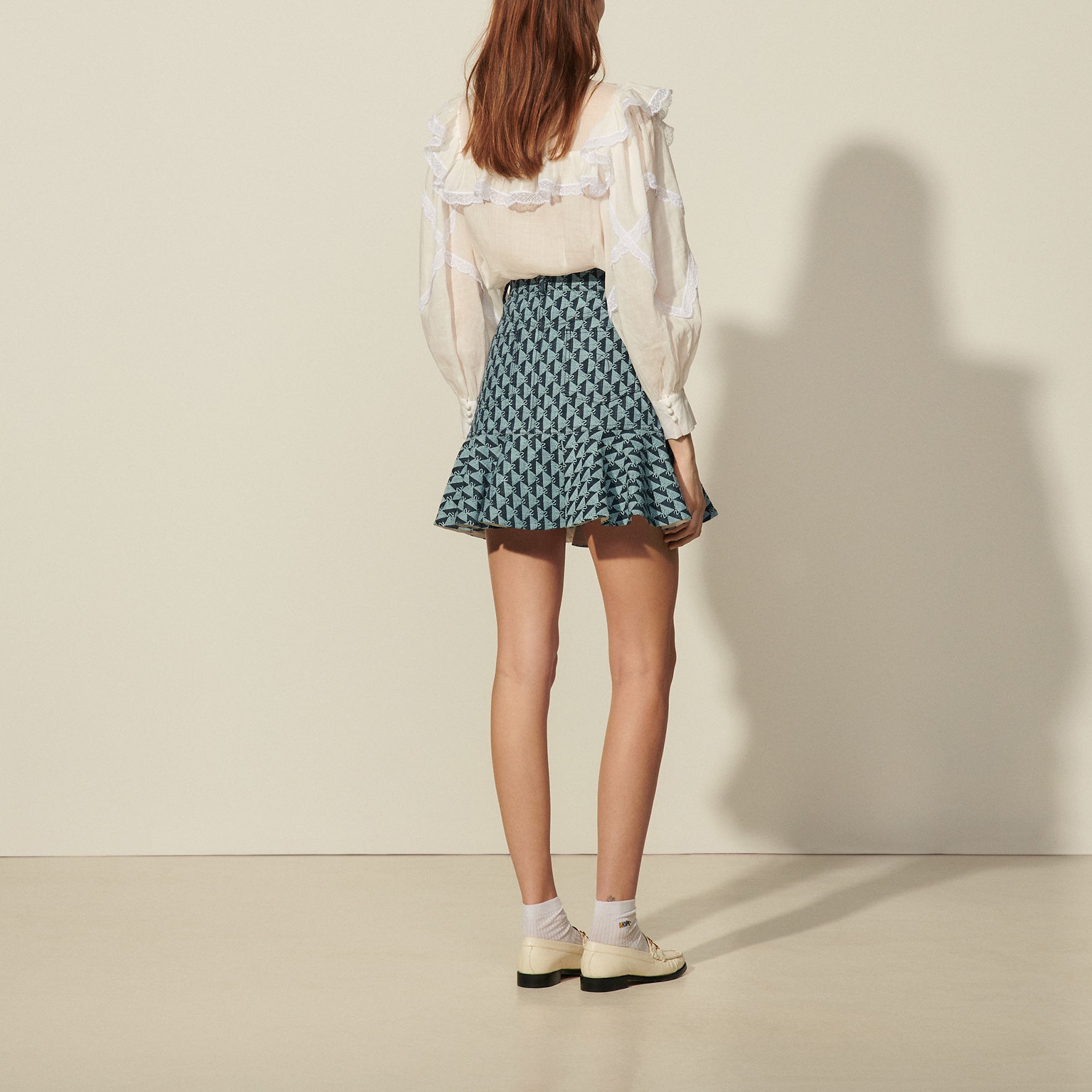 Jupe courte en monogramme denim Sandro seconde main