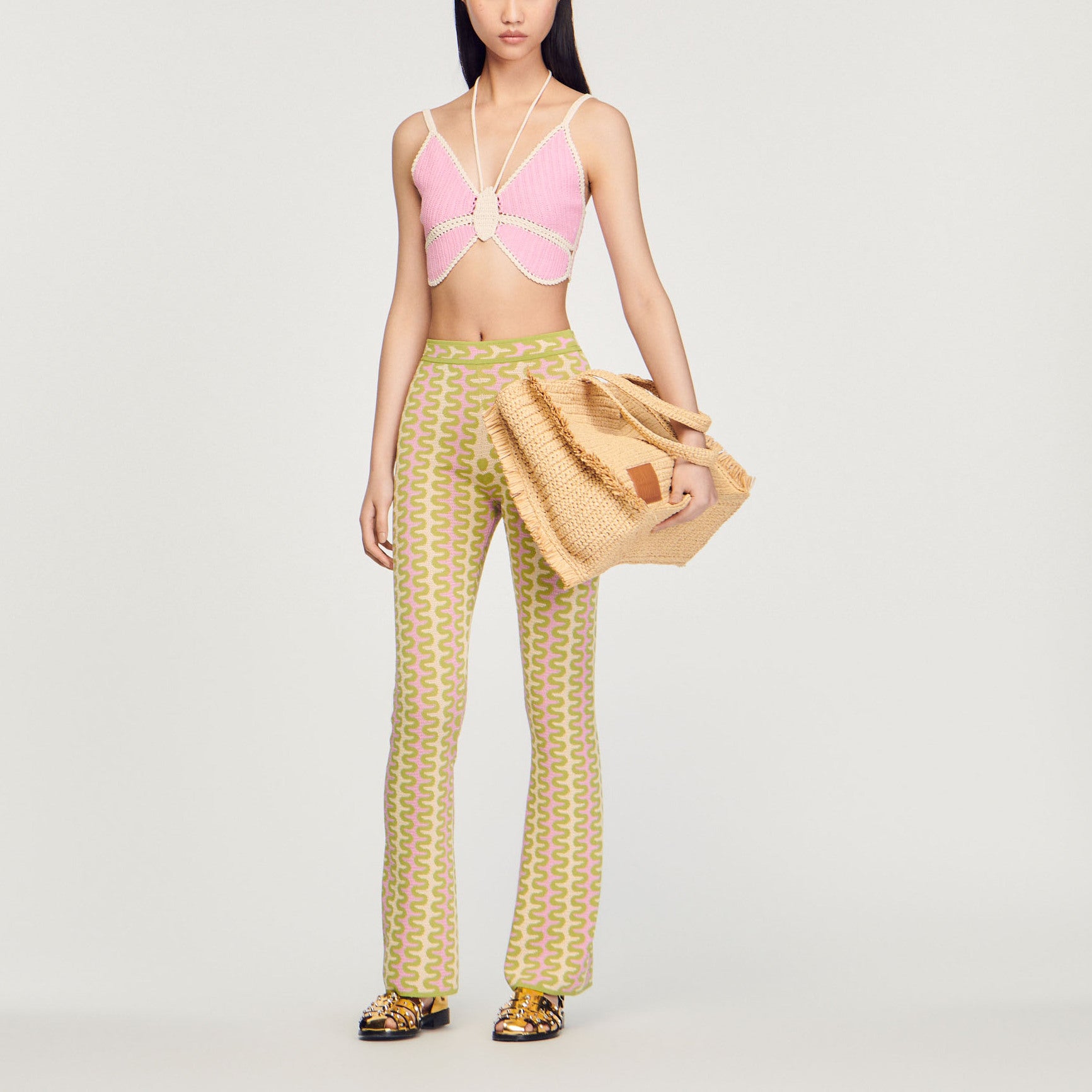 Pantalon en Maille à motifs Sandro seconde main