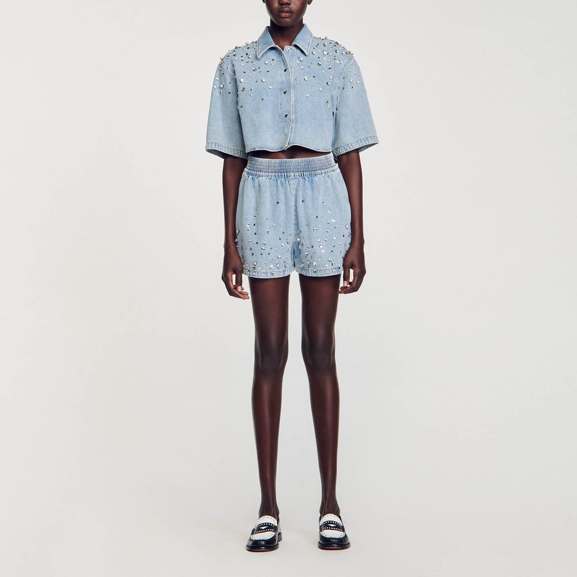 Short large en denim orné de strass Sandro seconde main